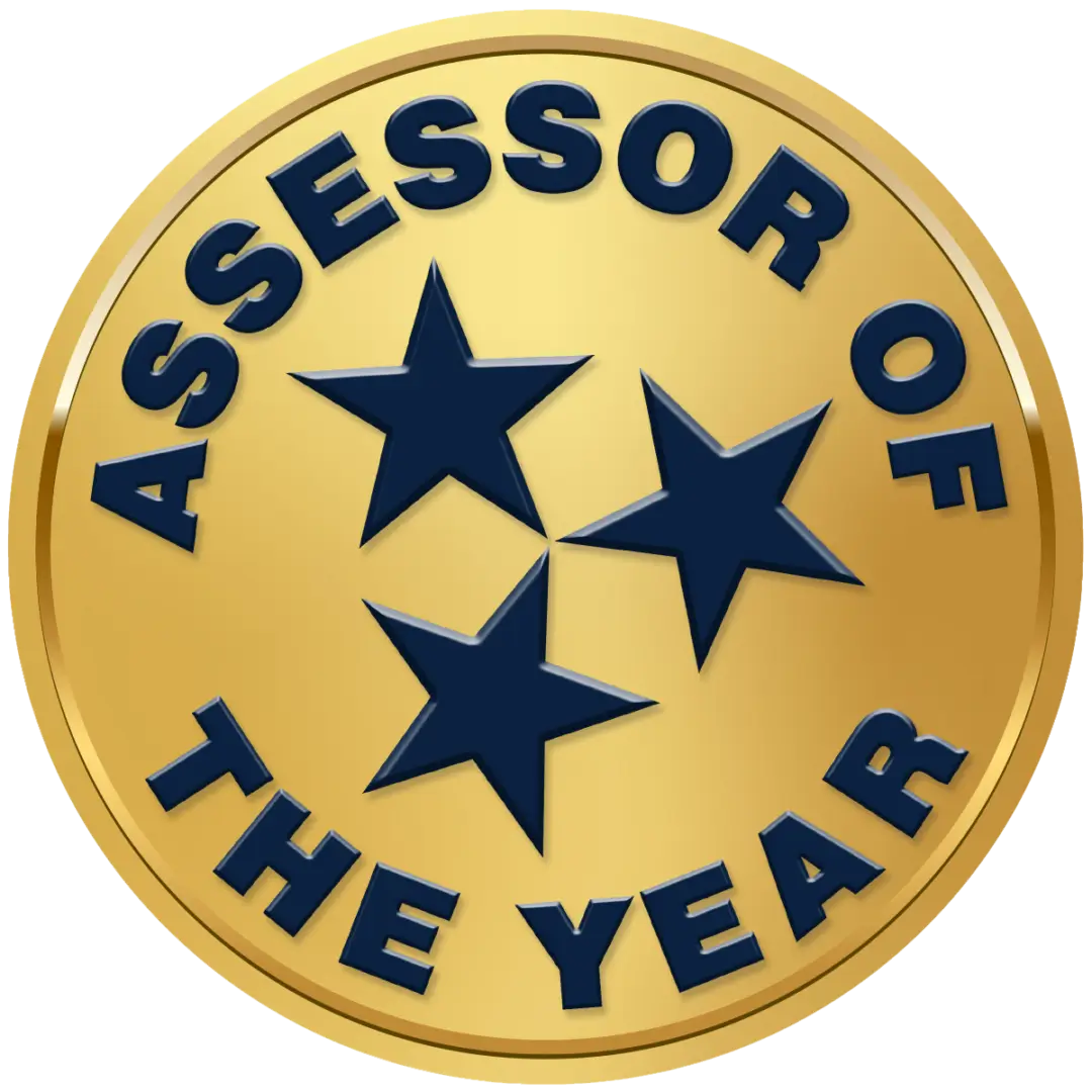 Gold badge reading 'Assessor of the Year' with three stars.